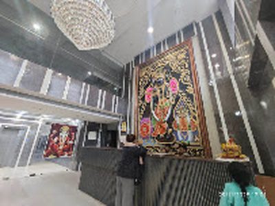 Reception lobby with chandelier and religious artwork at Shri Shiv Krishna Dham, Vrindavan